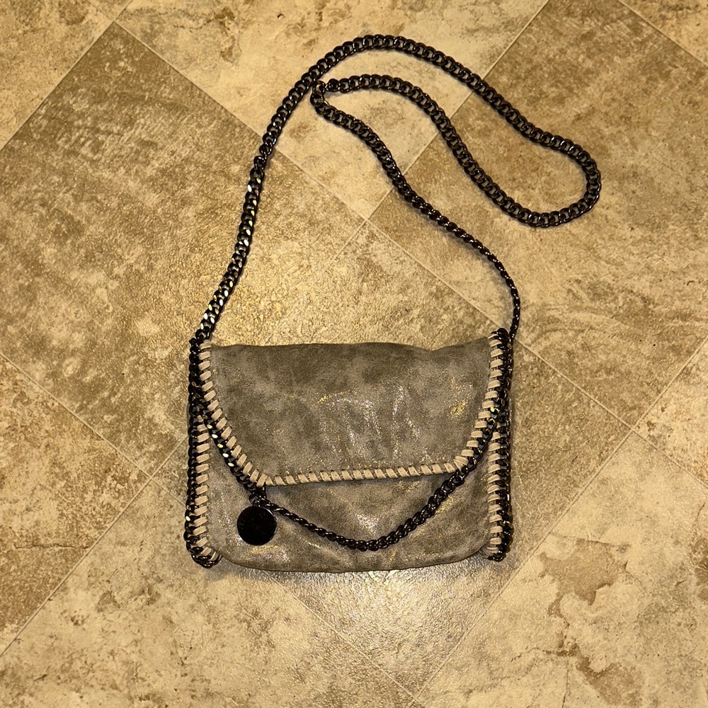 Like new Faux leather, metallic grey purse with metal chain strap.